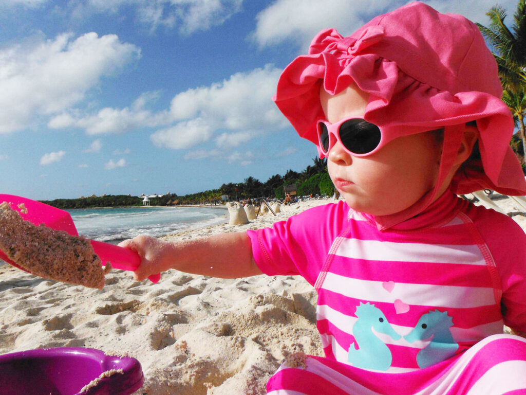 the best baby friendly all inclusive resorts have soft white sand for little ones to play in.