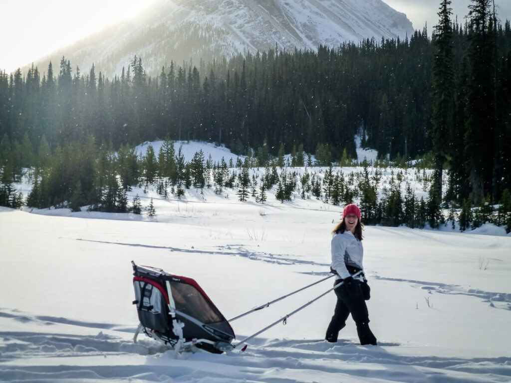 Celine Brewer, of BabyCanTravel.com, enjoys snowshoeing with a baby in a chariot with ski attachment.