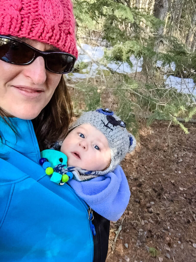 taking baby for a walk in cold weather in baby carrier and using jacket extender.