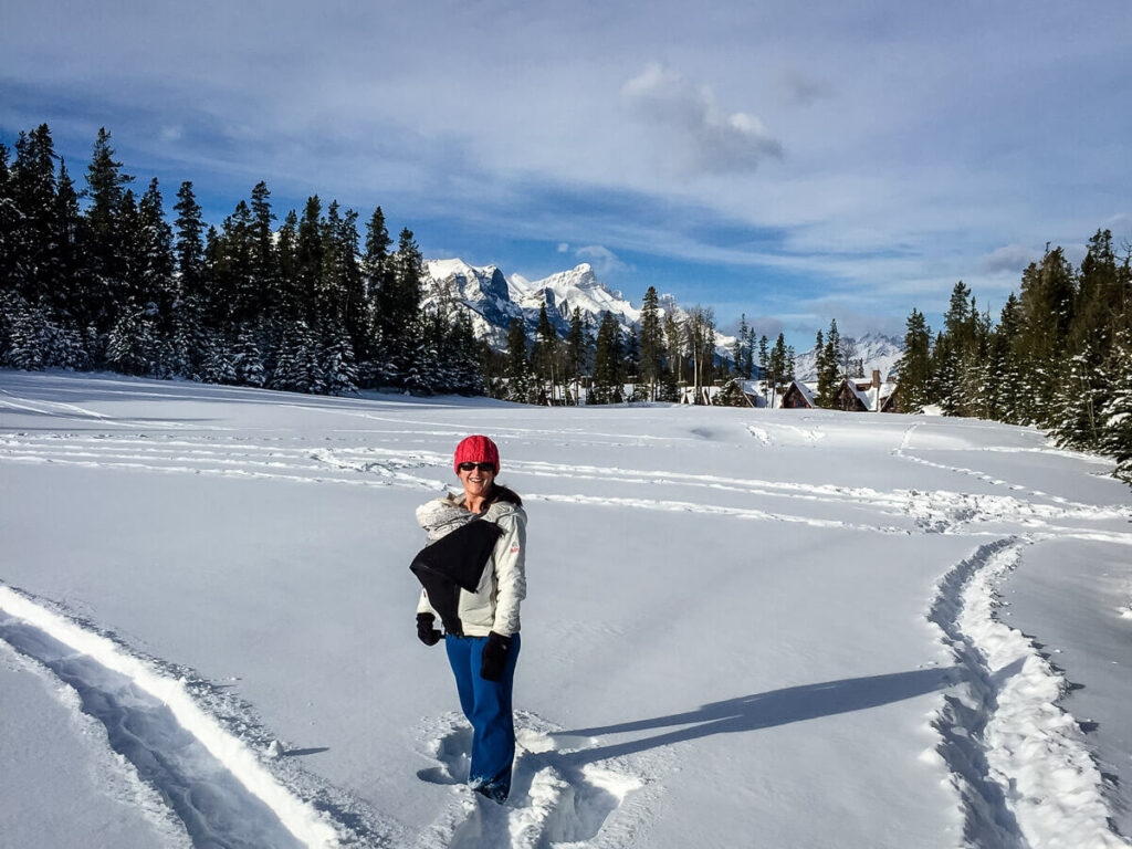 Celine Brewer, owner of the Baby Can Travel blog, enjoys a winter walk while carrying her baby.