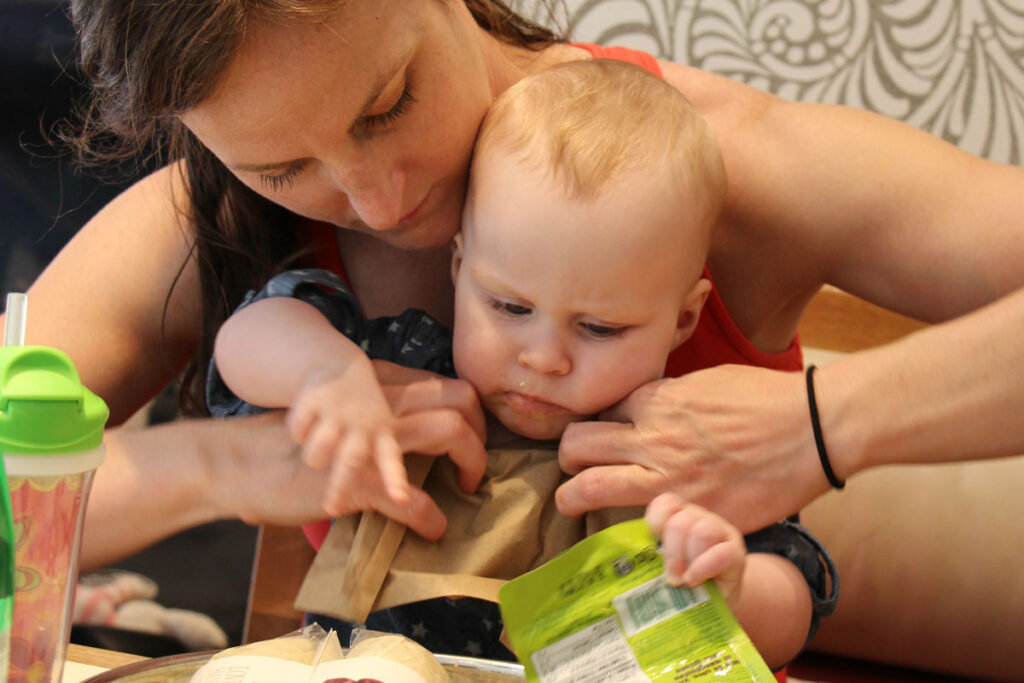 baby eating on lap