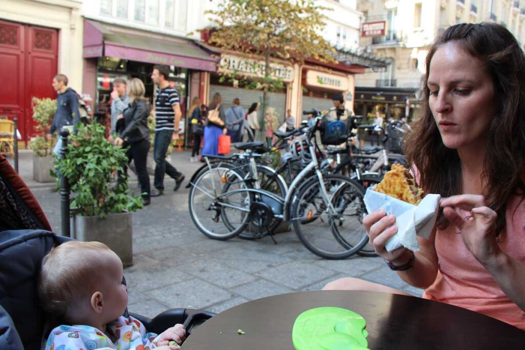 mother and baby eating outside in paris