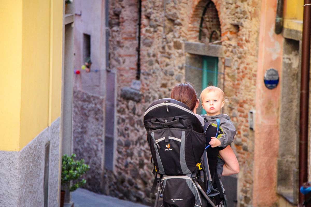 Carrying baby and using a hiking backpack carrier for toddlers in Cinque Terre Italy