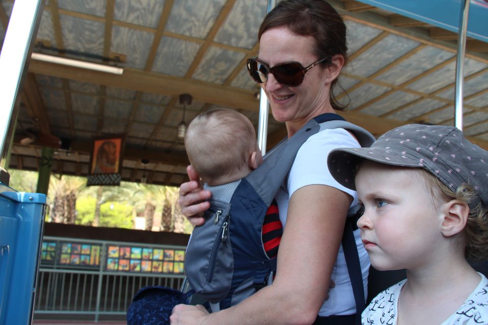 A baby in a carrier at the San Diego Wild Animal Park