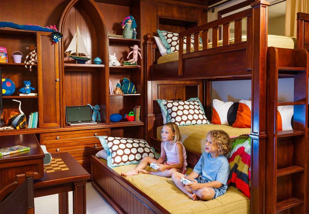 Children enjoying their own space in a family room at Beaches Turks and Caicos - a very baby friendly resort.
