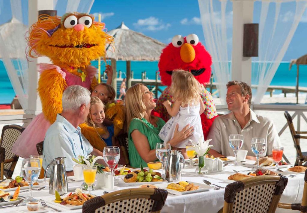 Sesame Street characters Zoe and Elmo visit guests at Beaches Turks & Caicos.