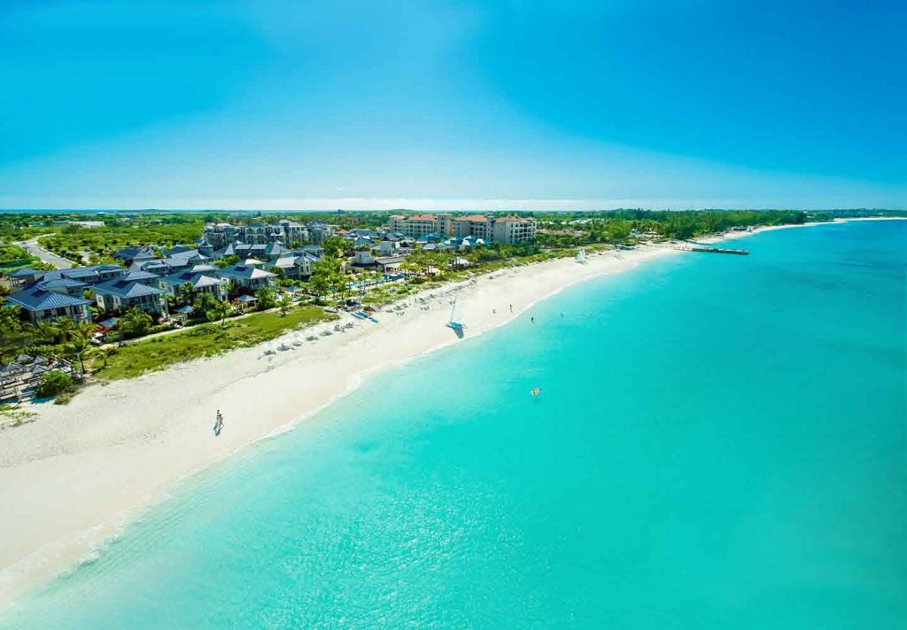 Aerial picture of the long stretch of white sand beach at Beaches Turks and Caicos - all inclusive resorts that are baby friendly.
