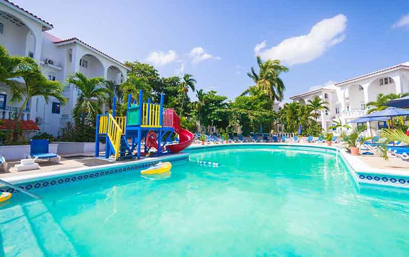 The pool with a play structure for kids at the baby-friendly Franklyn D. Resort & Spa in Jamaica