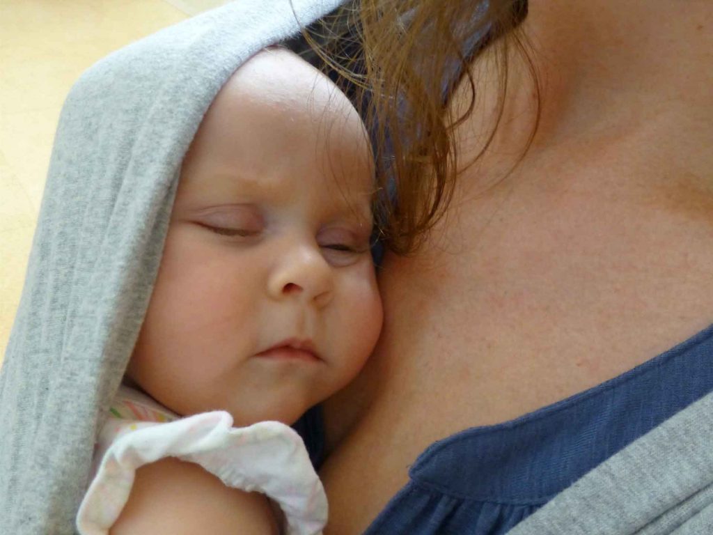 Baby in carrier at La Sagrada Familia Barcelona