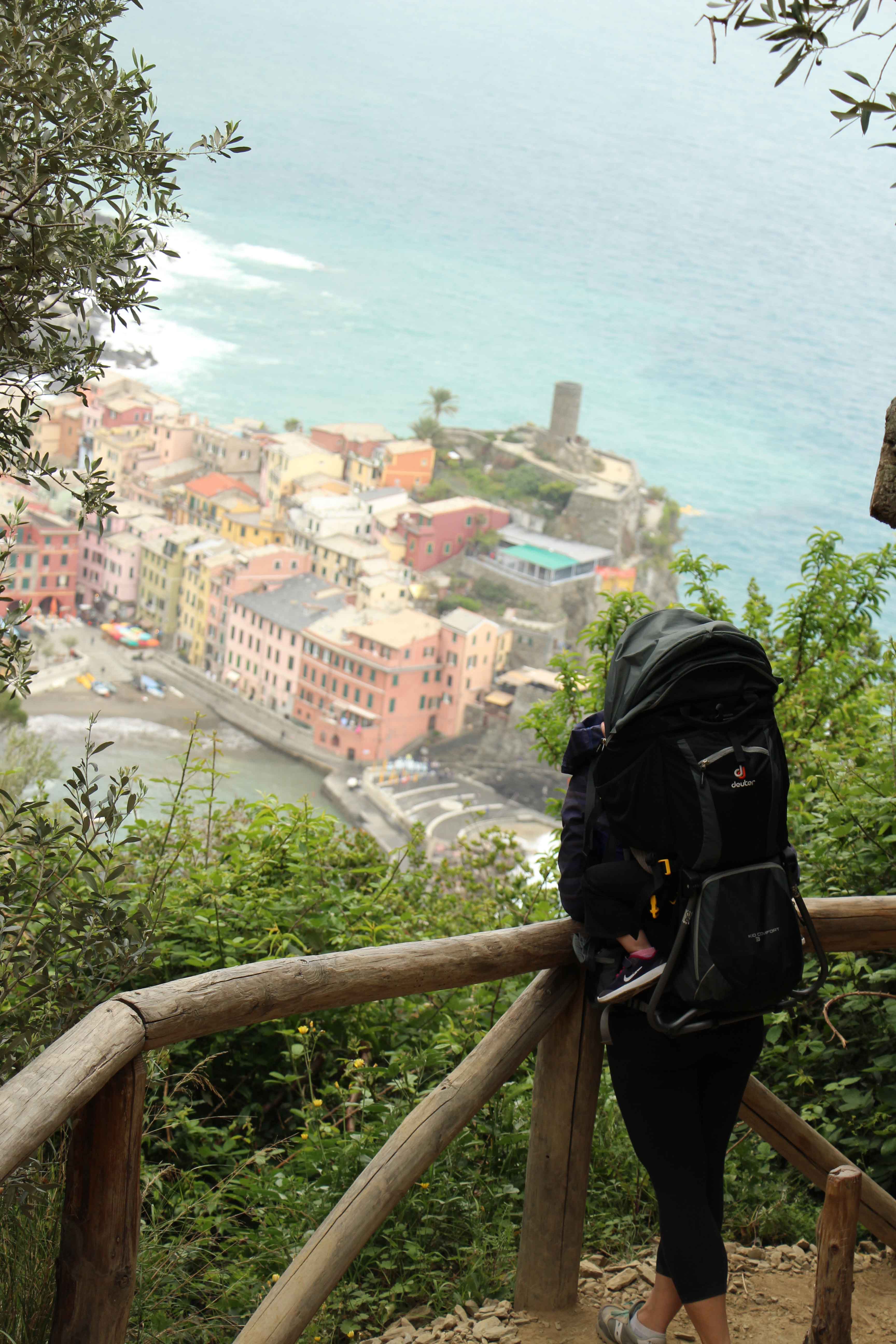 Celine Brewer of BabyCanTravel.com, carries her child in a Deuter Kid Comfort 3 while on a family trip to Cinque Terre, Italy.