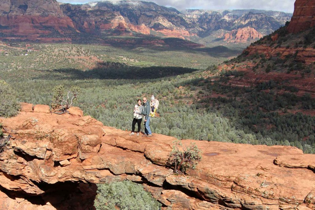 A family poses on the Devil's Bridge hike while on vacation in Sedona