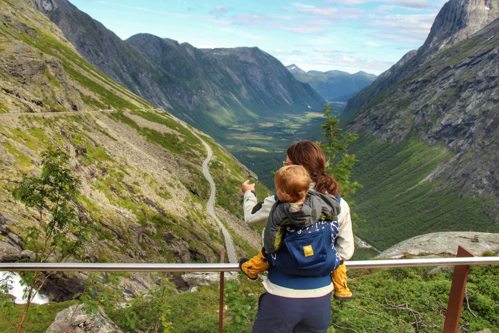 Celine Brewer, from BabyCanTRavel.com, carries her toddler in a Lillebaby Toddler Carryon while on a family road trip in Norway.