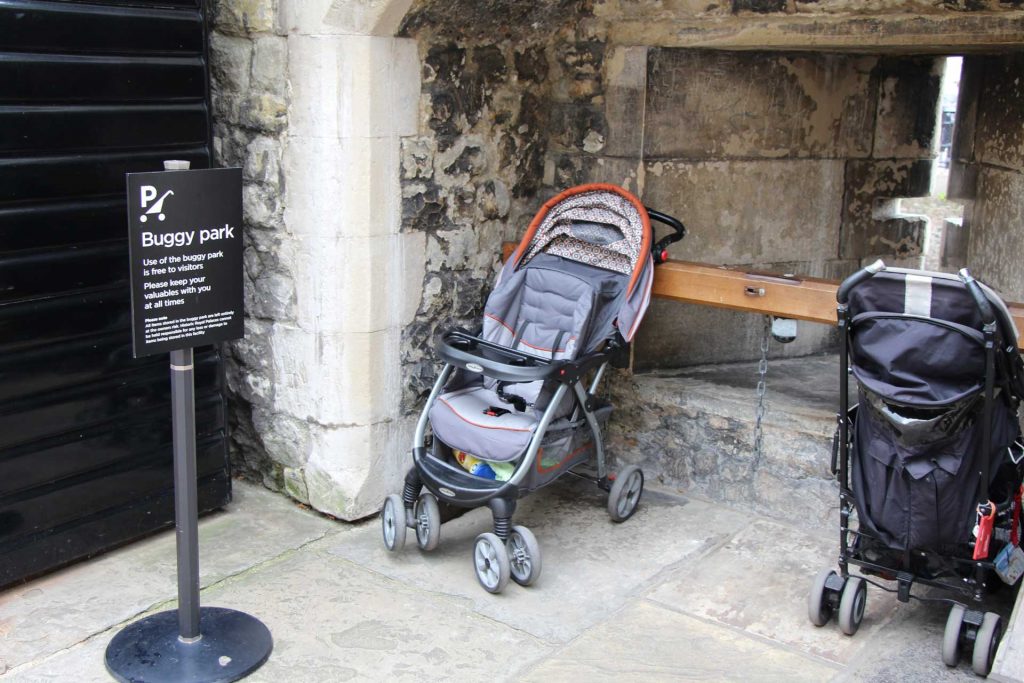 Celine Brewer, of BabyCanTravel.com, parks her travel stroller at the Tower of London while visiting with her baby.