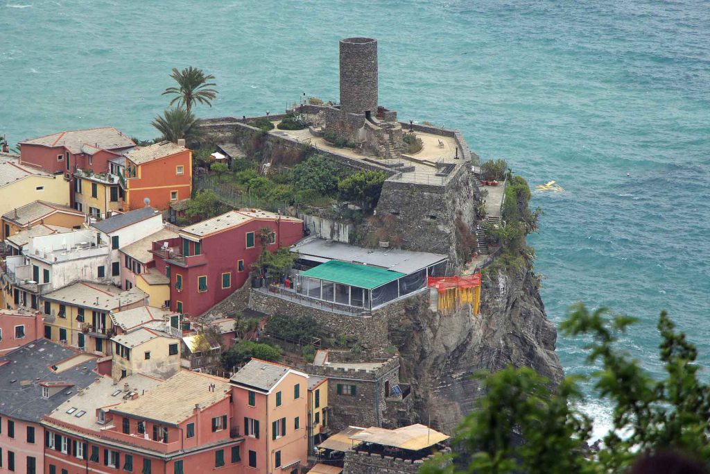 hiking from Corniglia to Vernazza provides an excellent aerial view of the Belforte Tower in Vernazza, Cinque Terre, Italy 