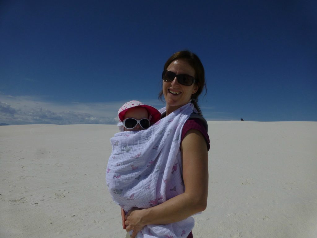 a well-covered baby is protected from the powerful New Mexico sun at White Sands National Park