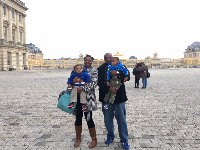 a family poses for a picture while on vacation.