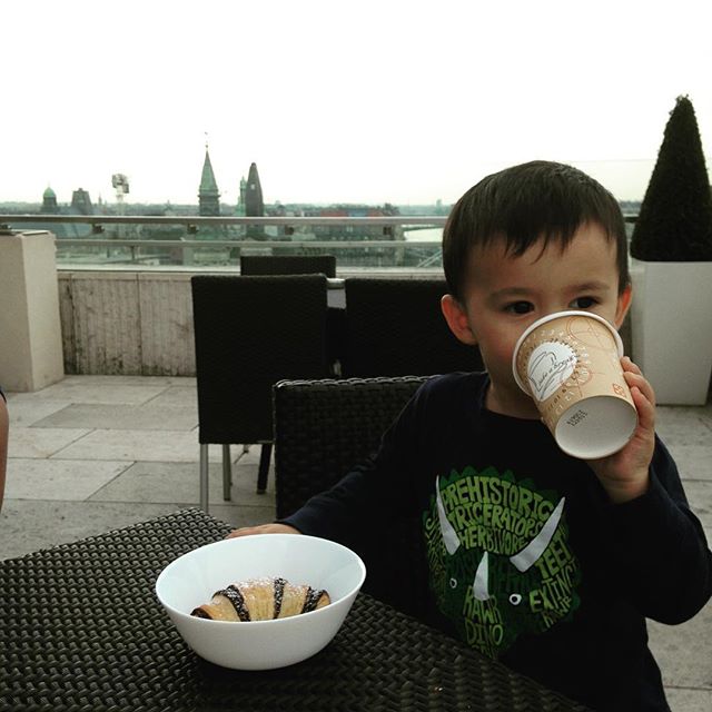 a toddler enjoying a snack on a fmaily trip.