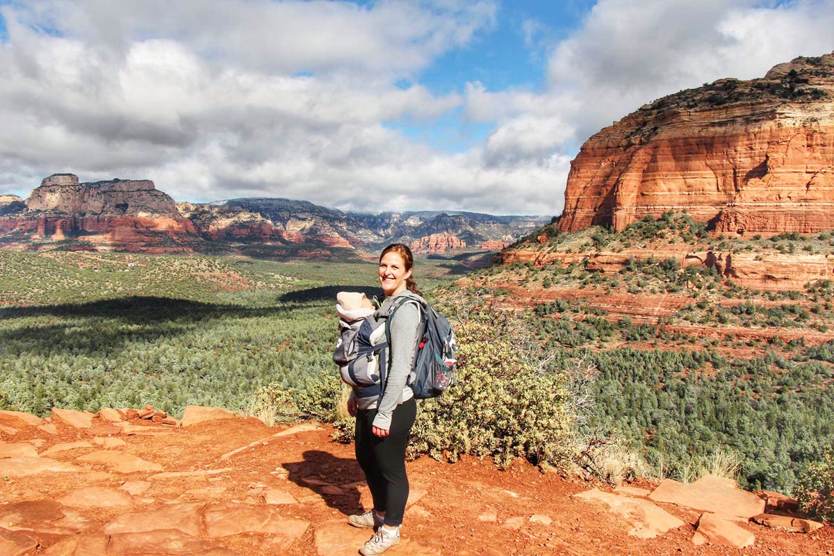 Celine Brewer, owner of BabyCanTravel.com, is hiking in Sedona with her baby in an Ergobaby carrier.