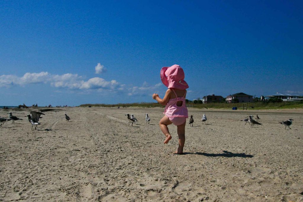 a wide brimmed sun hat is one of our Toddler beach essentials.