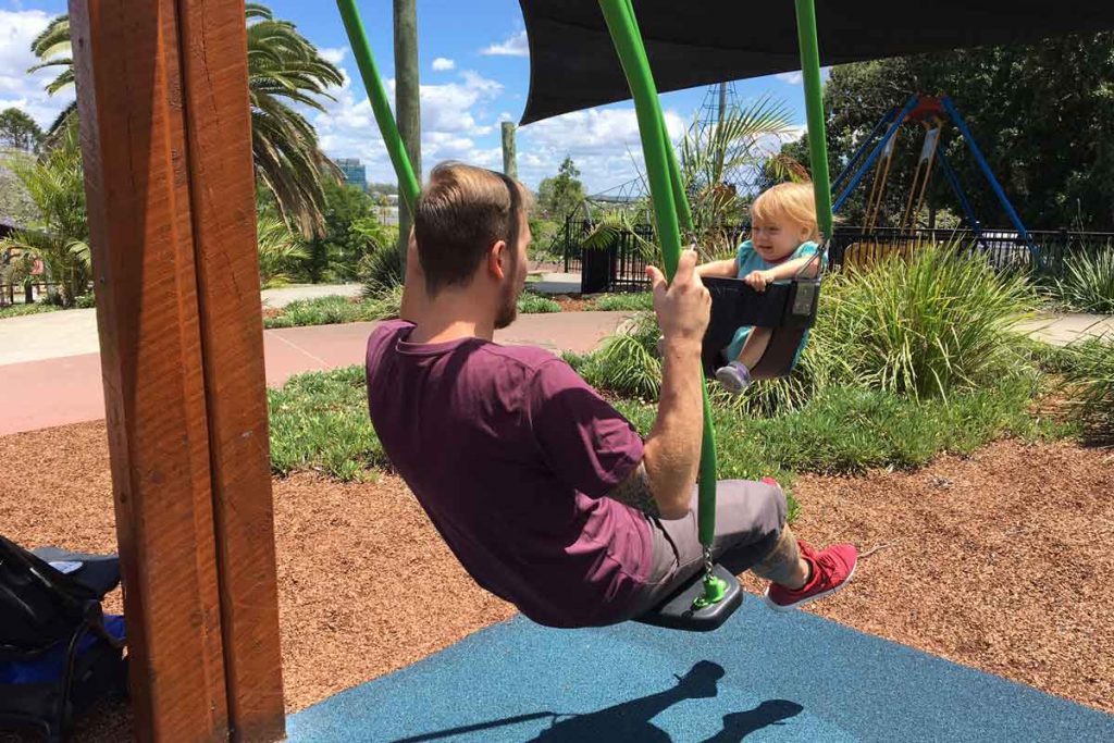 a day plays with his baby on a family vacation to Australia.