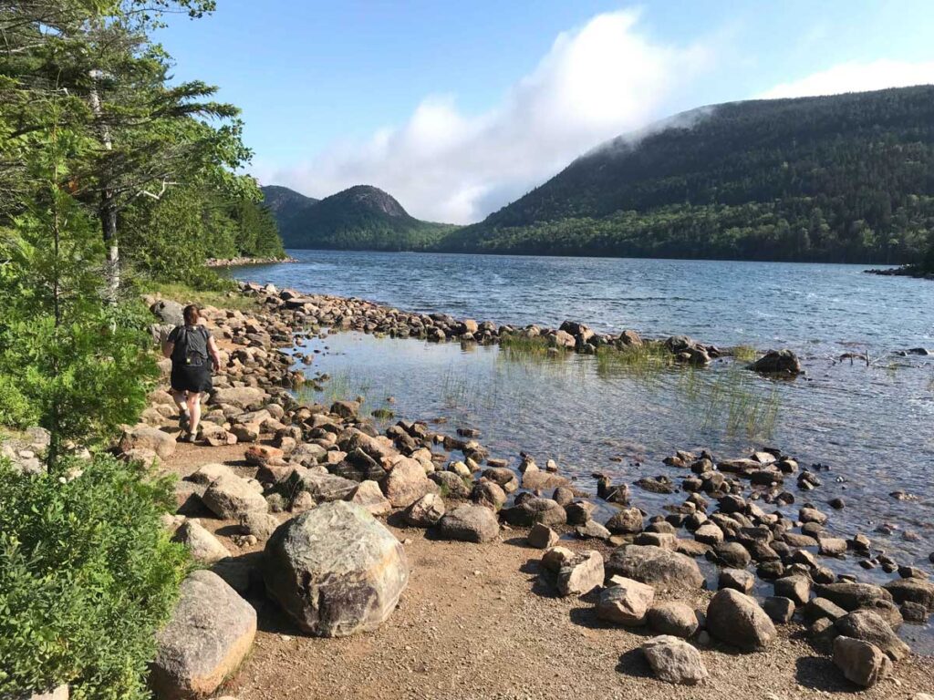 walking along a scenic lakeshore in Acadia National Park with a baby