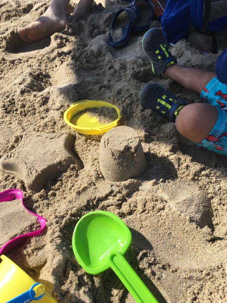 playing in the sand is one of the best things to do in Huntington Beach with kids