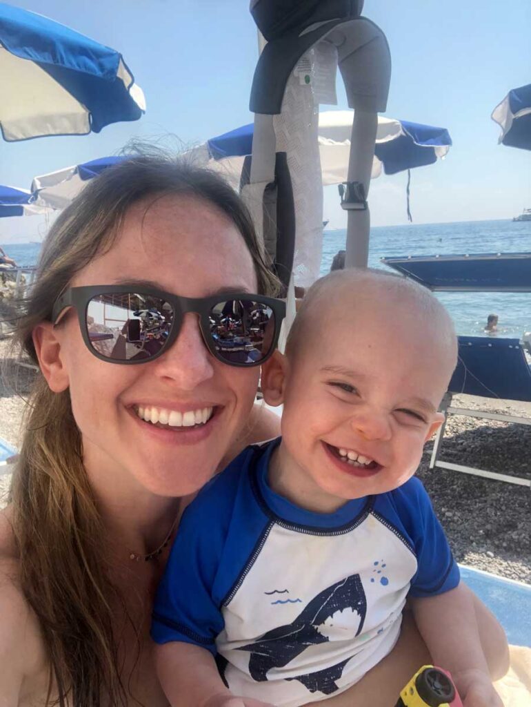 a happy family enjoying a kid-friendly Amalfi Coast beach