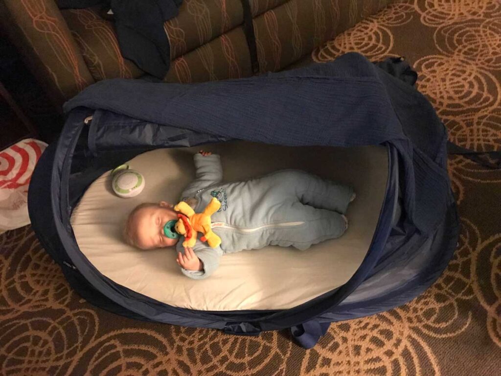 baby sleeping in Joovy Gloo baby travel tent