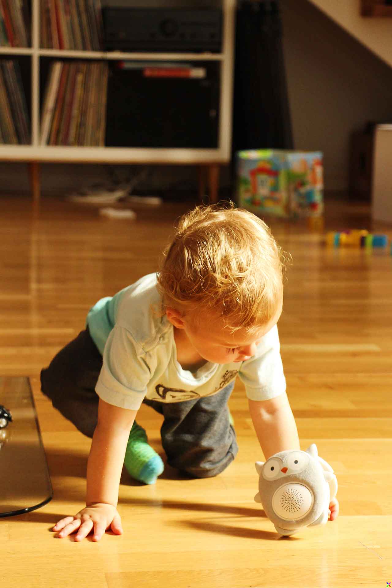 A toddler from BabyCanTravel.com plays with the Soundbub white noise machine while on a family trip to Norway.