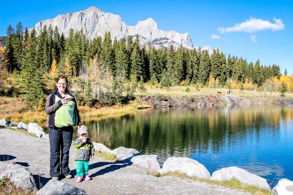 a mom enjoys an easy hike in Canmore, Alberta with her newborn and toddler