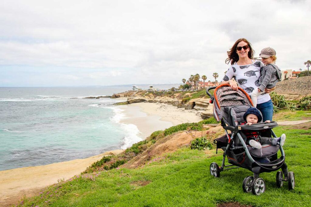 a mom visits La Jolla in San Diego with hera baby and toddler