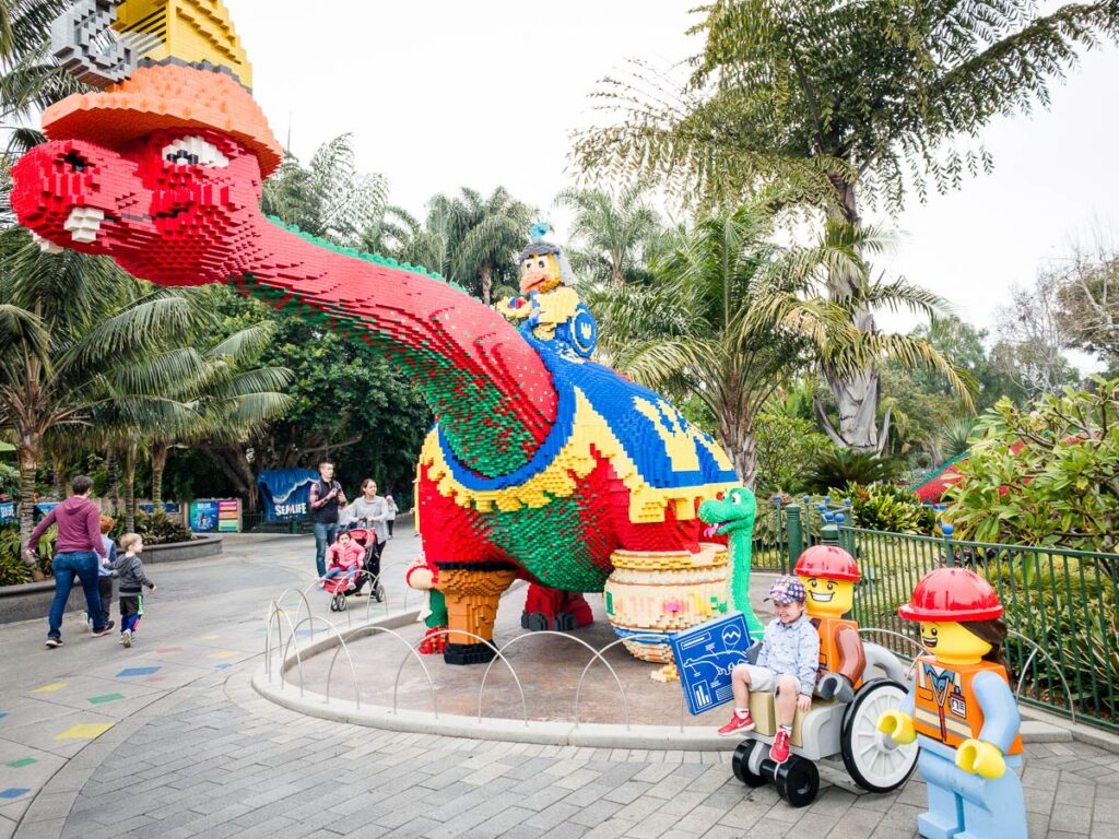 a toddler is all smiles at Legoland - one of the best toddler activities in san diego, CA.
