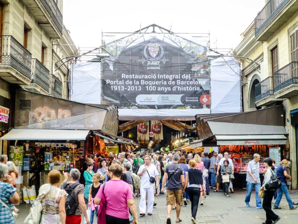 Entrance to Mercat de la Boqueria in Barcelona with a toddler