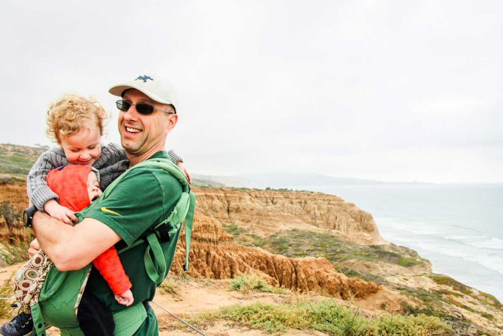 A family hug while on a kid-friendly hike in Torrey Pines Natural Reserve