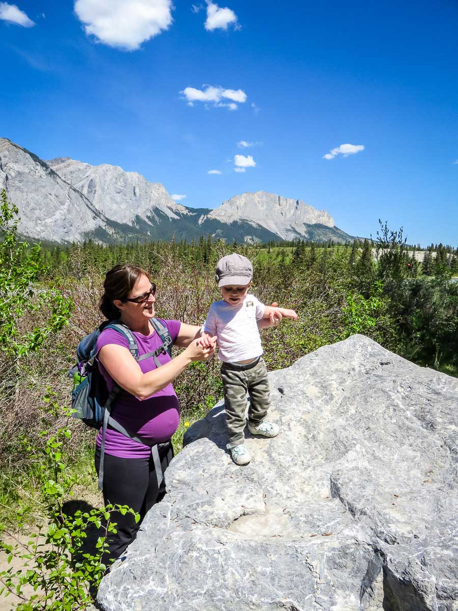 a pregnant mother is hiking with a toddler near Banff National Park in Canada.