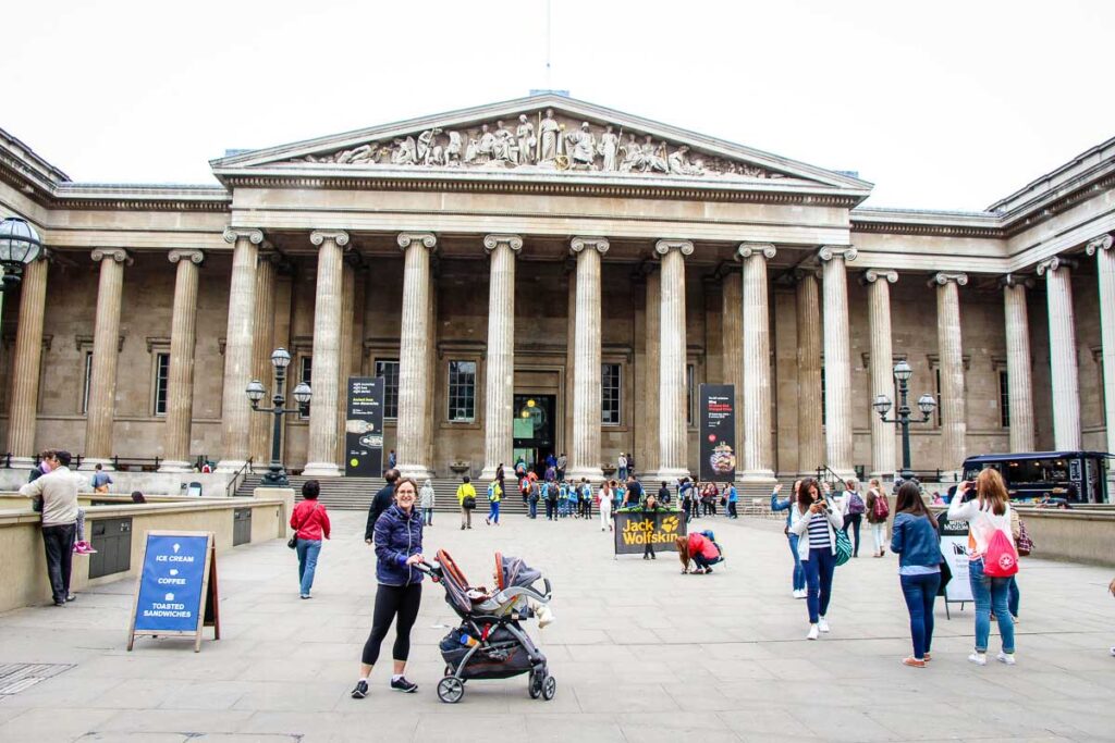 in front of British Museum in London with baby stroller