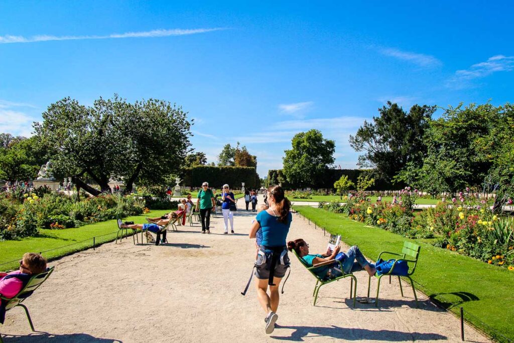 Walking in Jardins des Tuileries in Paris with toddler