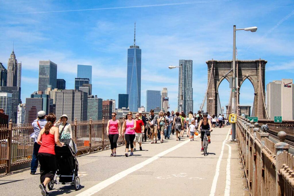 walking across brooklyn bridge with baby in stroller