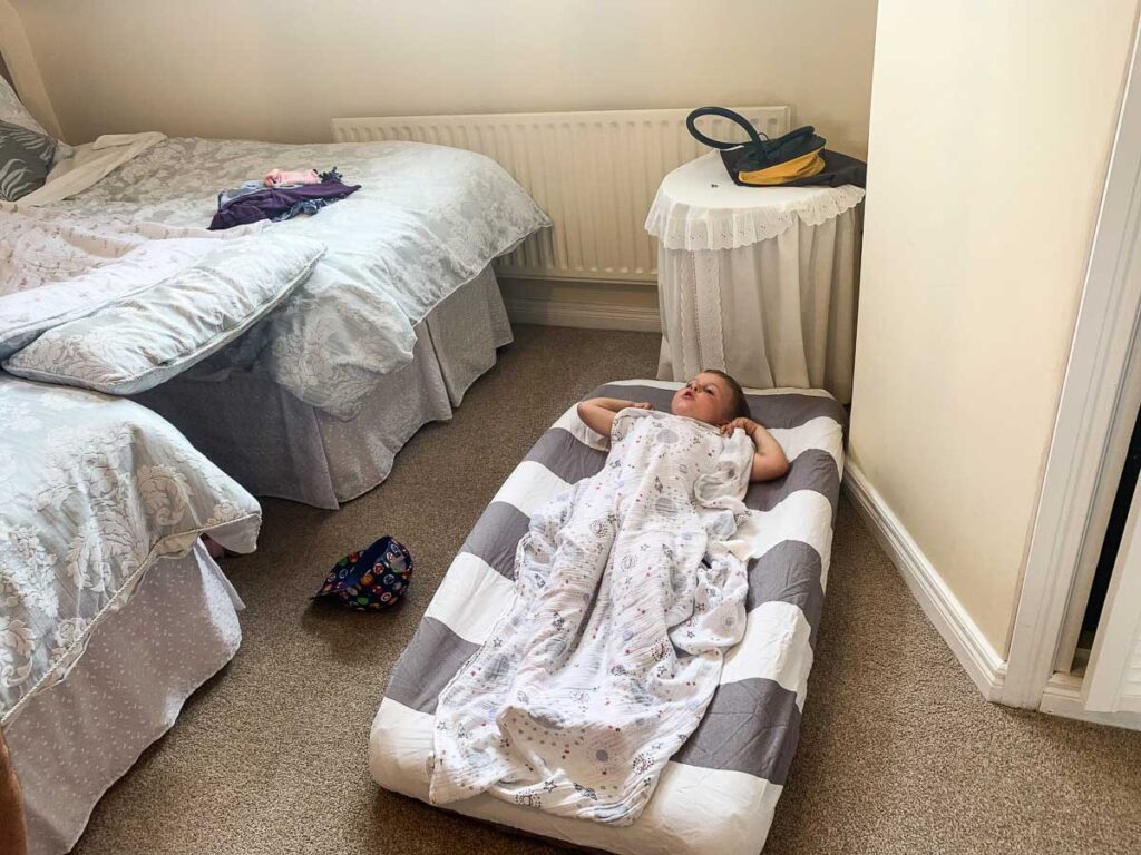 one of our most useful travel hacks for toddlers is to pack an inflatable toddler travel bed. 