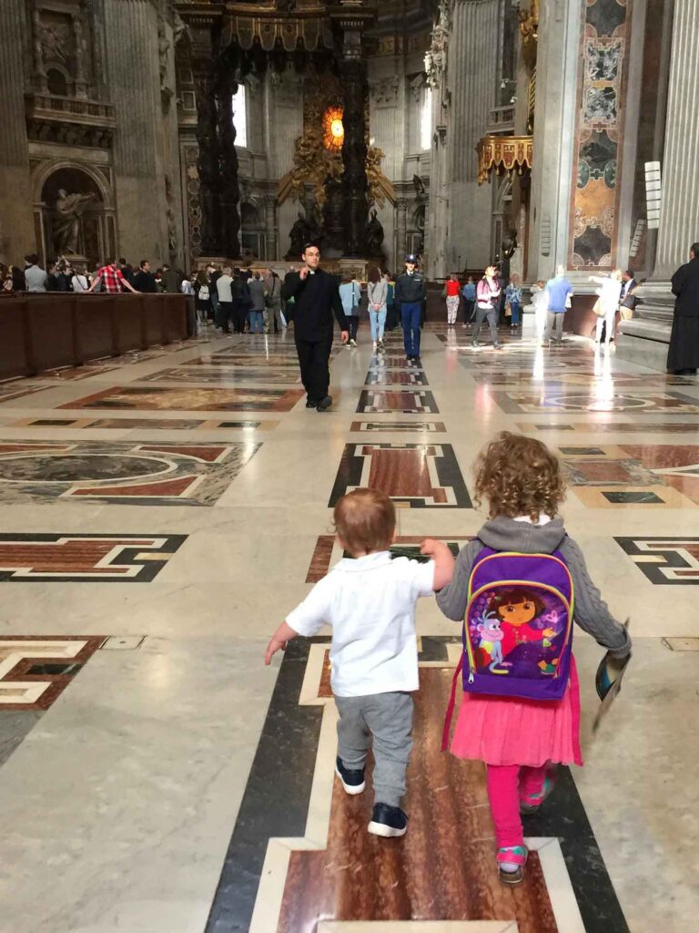 We hope our toddlers behave in front of the priest at St. Peters Basilica at the Vatican in Rmoe