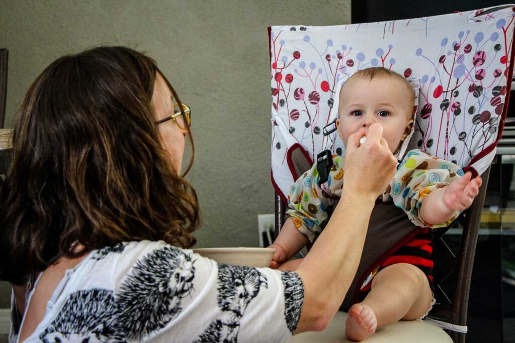 feeding baby on vacation in airbnb apartment