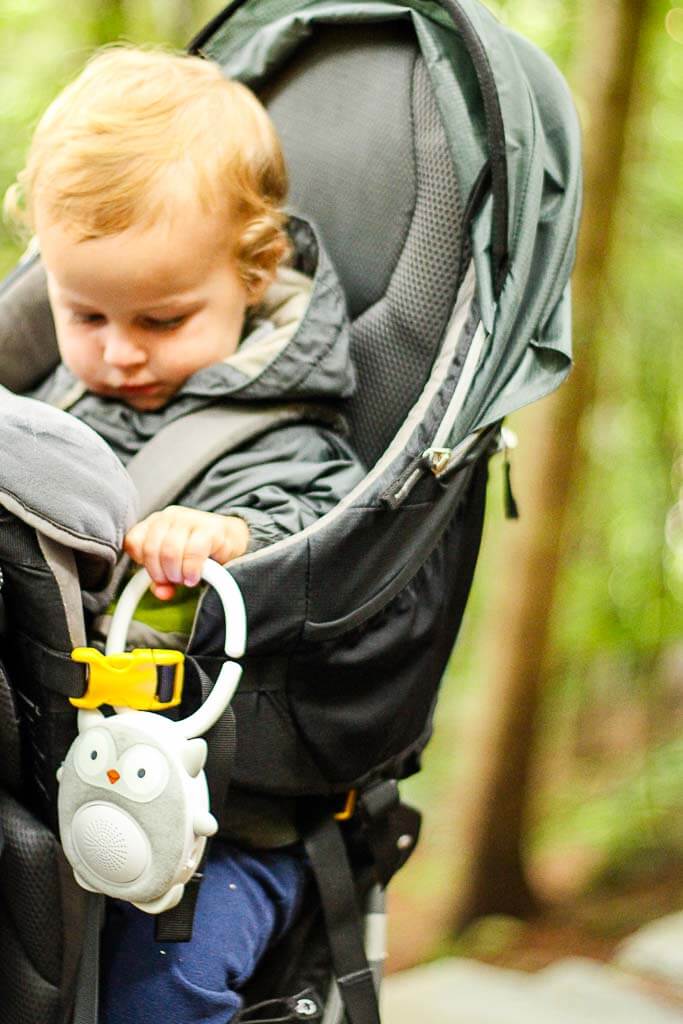 a BabyCanTravel.com toddler uses a sound machine while traveling with his family.