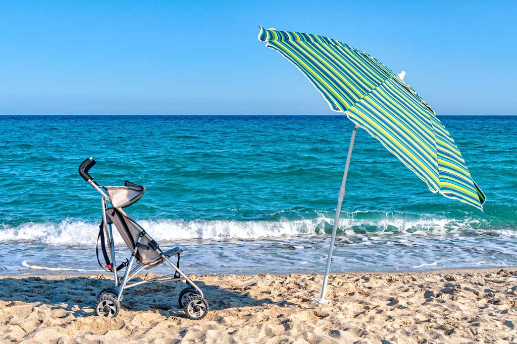 umbrella travel stroller on beach