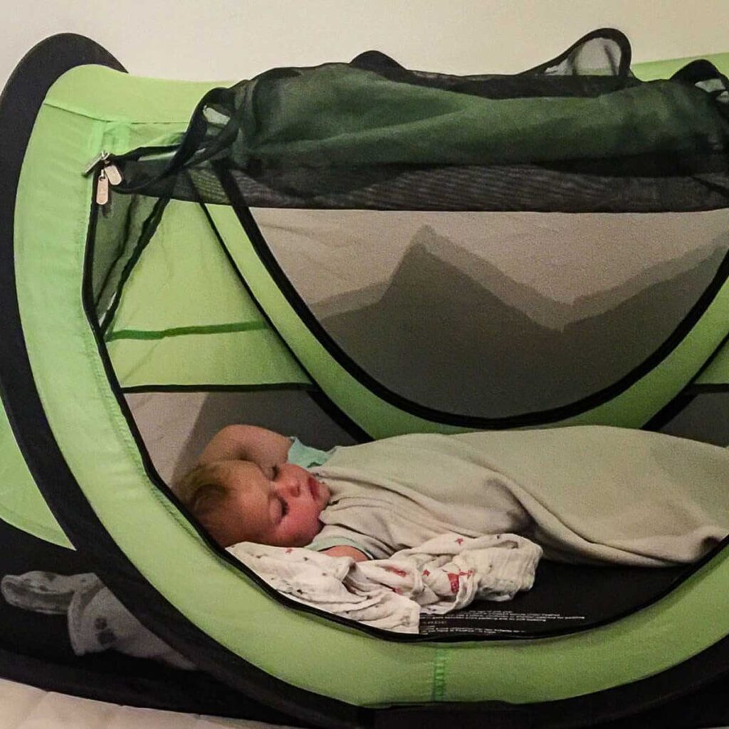 A portable travel bed is great for increasing your selection of infant-friendly Airbnb rentals