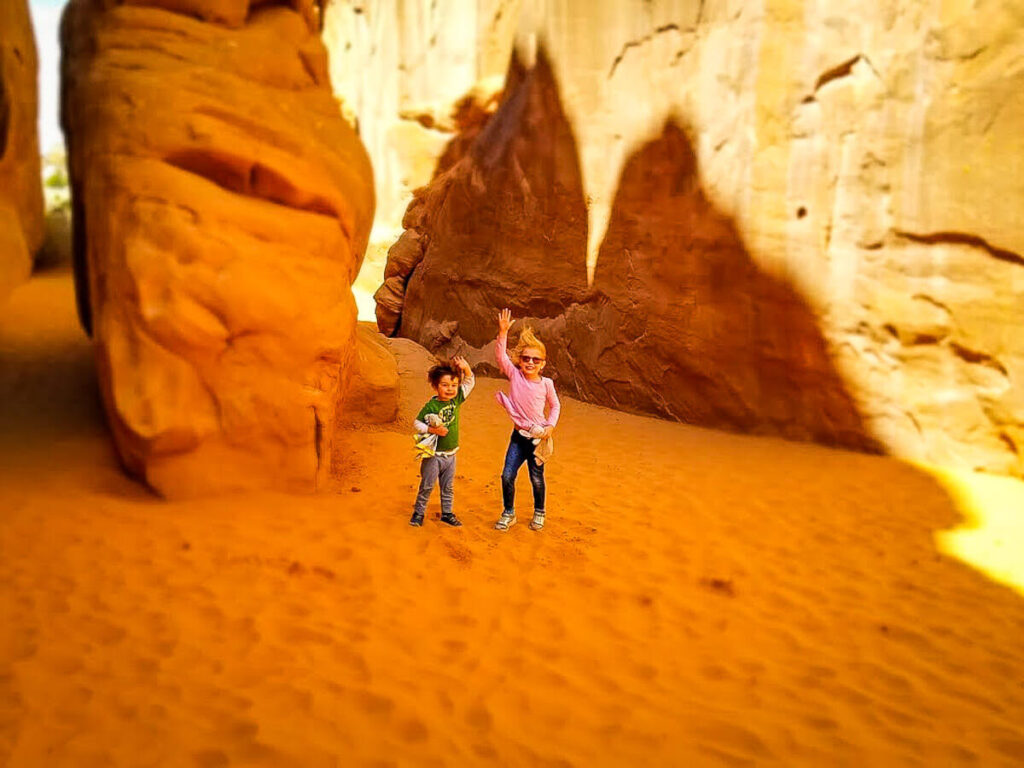 fun things to do on a Utah road trip with kids - Sand Dune Arch in Arches National Park with toddler