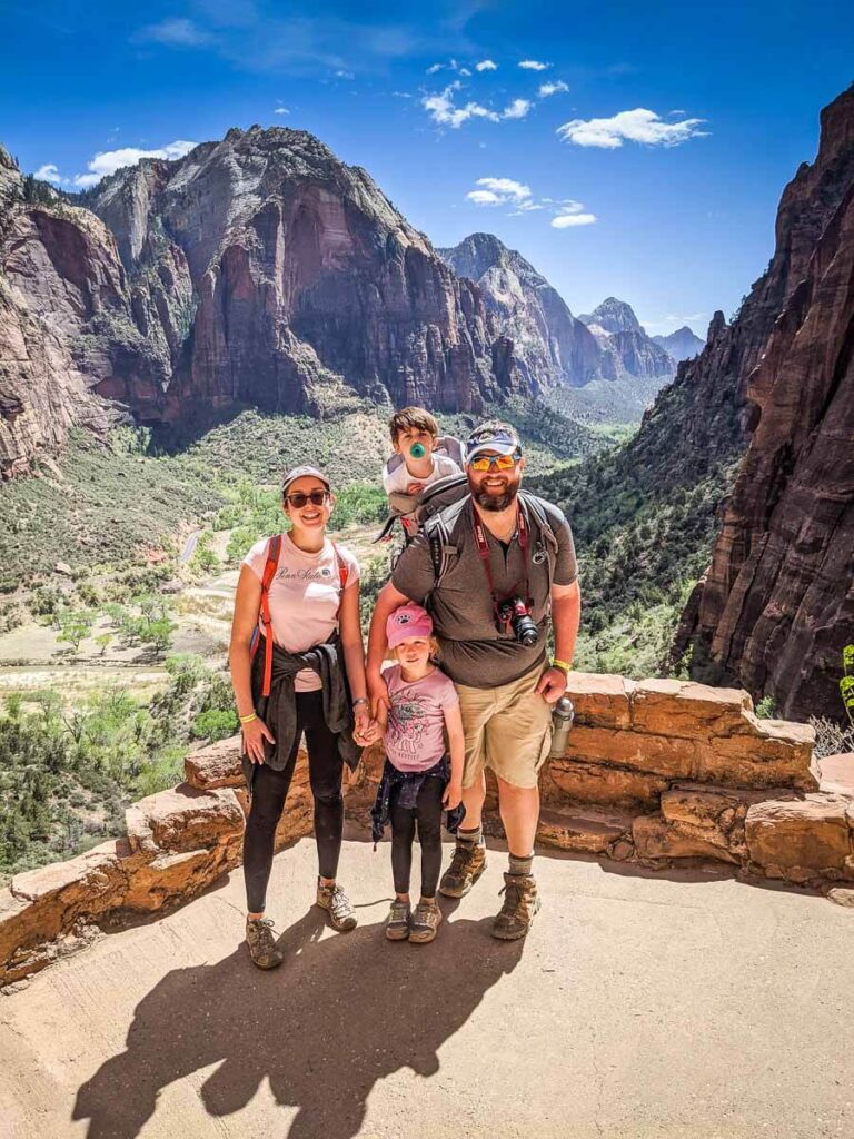 Visit Utah's Mighty 5 national parks on a family road trip - enjoy the view from Scouts Lookout in Zion National Park with a toddler