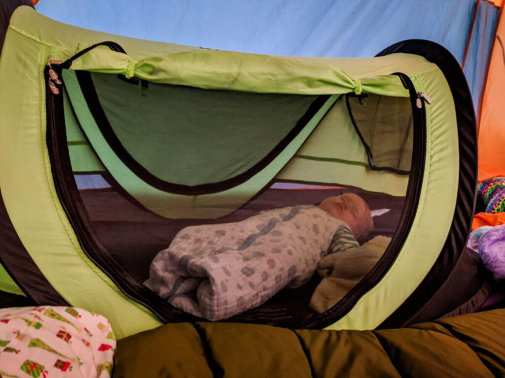 Toddler sleeping in Peapod Plus toddler camp bed