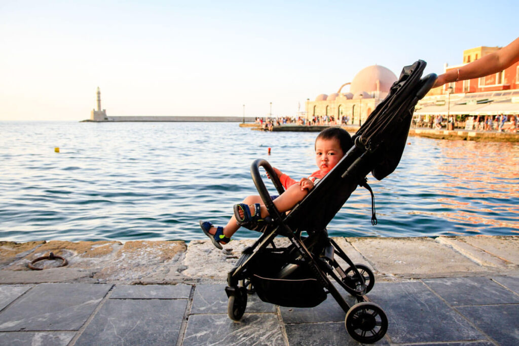 toddler in Crete sitting in light travel stroller