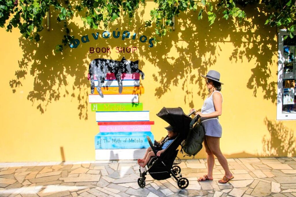 a mother pushing lightweight compact stroller in Crete.