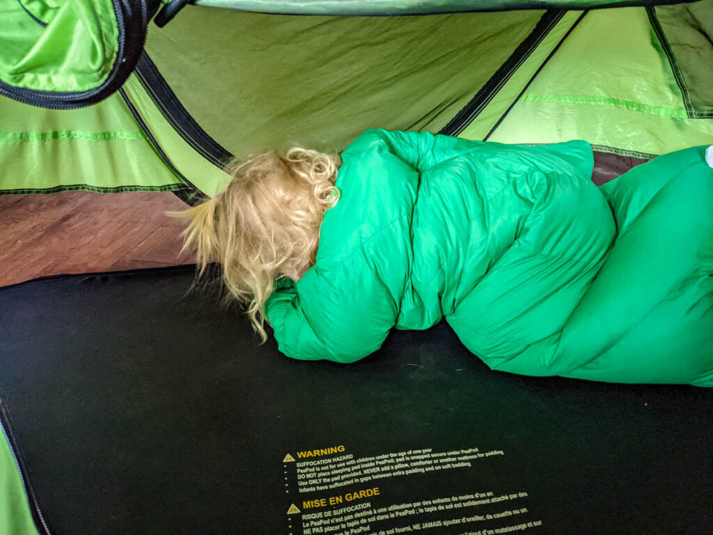 Toddler in Peapod Plus wearing Morrison Outdoors Toddler Sleeping Bag